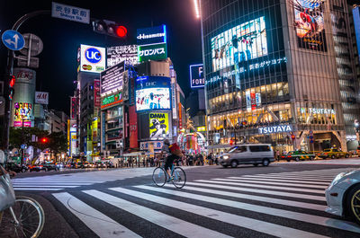 Cars on road in city at night