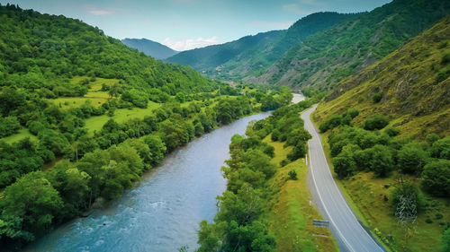 High angle view of road amidst mountains against sky