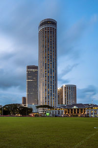 Modern buildings against sky in city