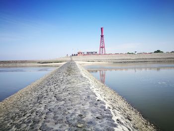 Scenic view of lake against clear blue sky