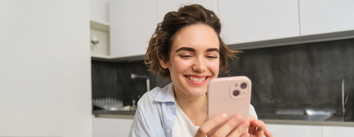 Young woman using mobile phone