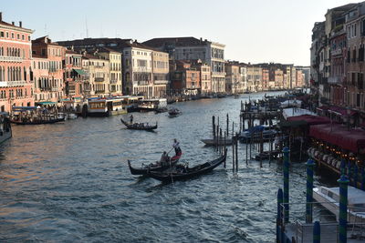 Gondoliers moving in famous river in venice.    