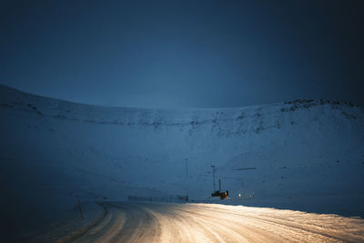 Low section of man standing on mountain