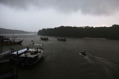 High angle view of boats moored in sea against sky