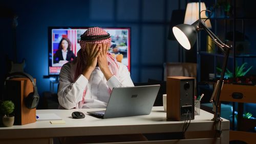 Young woman using laptop at office