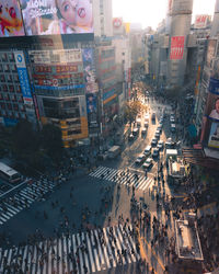 High angle view of traffic on city street by buildings