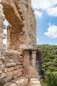 Low angle view of old ruins against sky