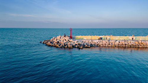 Scenic view of sea against clear blue sky
