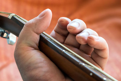 Close-up of hands holding baby hand