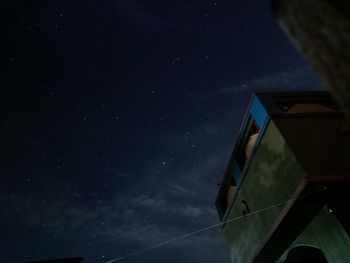 Low angle view of building against sky at night