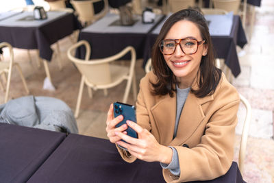 Young woman using mobile phone
