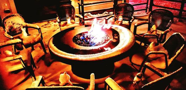 High angle view of burning candles in temple