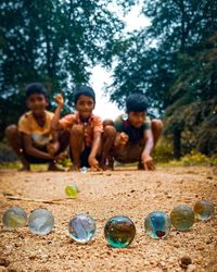 Group of people playing soccer on land