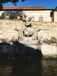 Statue in front of building