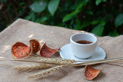 Close-up of coffee and cups on table