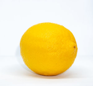 Close-up of orange slice against white background