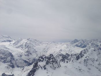 Scenic view of snow covered mountains