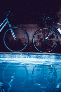 Reflection of bicycles on swimming pool