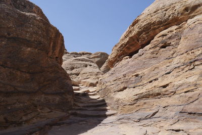 Low angle view of rock formations against clear sky