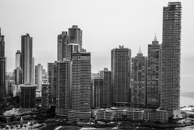 Skyscrapers in city against clear sky