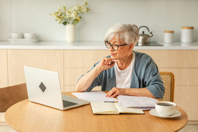 Young man using laptop on table