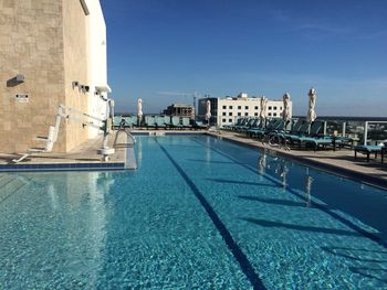 View of swimming pool against buildings