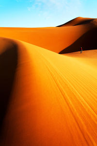 Sunlight falling on desert against sky