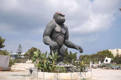 Low angle view of statue against sky in city