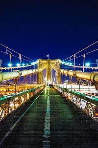 Illuminated bridge at night