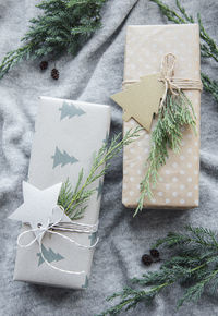 Christmas presents on gray knitted textile background. 