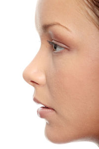 Close-up portrait of a beautiful young woman over white background