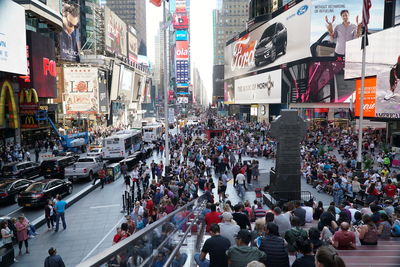 Group of people walking on road in city