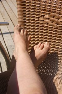 Low section of man relaxing on floor