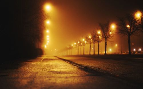 Illuminated street lights at night