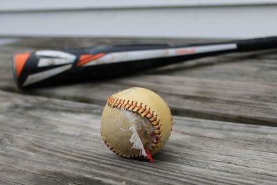 Close-up of torn ball on table