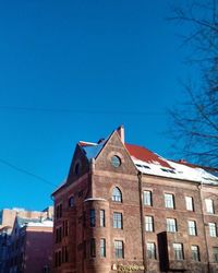 Low angle view of building against blue sky