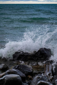 Sea waves splashing on rocks