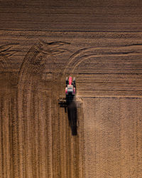 Aerial view of tractor on agricultural land