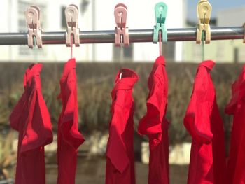 Close-up of clothes drying against blurred background