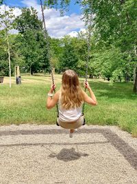 Rear view of woman walking in park