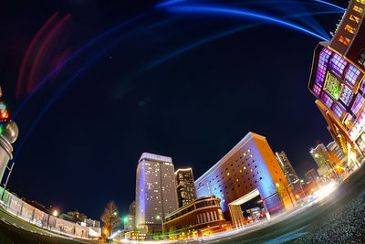 Illuminated buildings in city at night