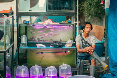 Portrait of man working at fish market