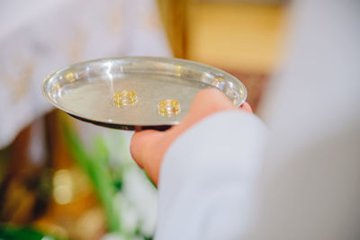 Close-up of man holding beer glass