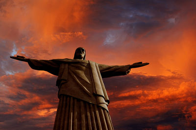 Low angle view of statue against sky during sunset