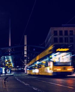Blurred motion of illuminated street at night