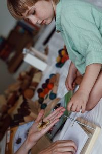 Close-up of boy drawing on book