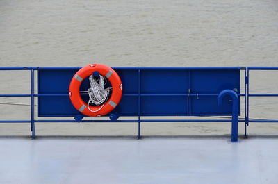 Life belt on ship railing in sea