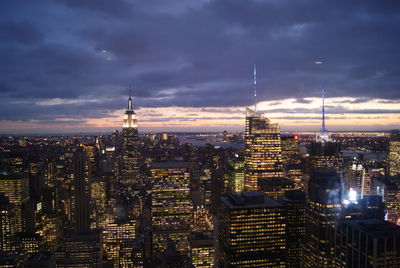 High angle view of city lit up at dusk