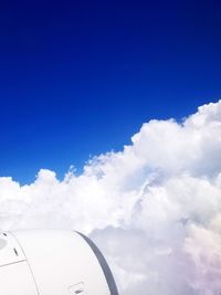 Low angle view of airplane flying in sky