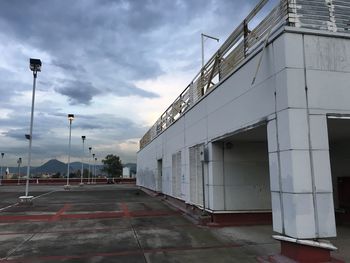 Empty road with buildings in background